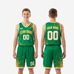 Back view of custom kids basketball uniform in green and gold showing player name across upper back and back number on dot-splash jersey