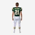 Right side view of custom youth American football uniform in green and gold with sleeve number and pant side stripe detail