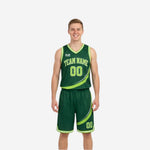Green and white reversible basketball uniforms showing forest green jersey with lime green swoosh graphic and matching shorts on male model