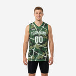 Men's green basketball jersey designs with woodland camo pattern and white lightning crackle print, front and back view showing team name and number