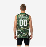 Right side view of men's green basketball jersey in camo and white lightning pattern showing jersey length and athletic cut