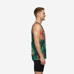 Custom green basketball jersey with cream and coral palm-leaf pattern, V-neck coral trim, and bold front number, front view on male model