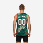 Opposite side view of green basketball jersey with all-over palm-leaf pattern and coral V-neck trim on adult male model