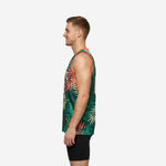 Side view of green sublimated basketball jersey showing coral armhole binding and full-panel tropical palm-leaf print from shoulder to hem