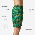 Close-up detail of elastic waistband and internal drawcord on green and gold custom sublimated basketball shorts