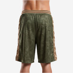 Opposite side view of sublimated green basketball shorts showing the dual camo design and small side split at the hem leg opening