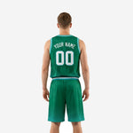 Left-side view of the custom teal-trimmed green basketball uniform showing the sleeveless jersey and matching basketball shorts from the opposite angle
