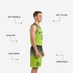 Close detail of lime green basketball shorts with circle-cluster graphic on left leg, player number on right thigh, and gradient fade to charcoal hem