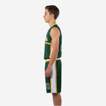 Opposite side view of custom green and gold youth basketball uniform set showing sublimated white side panel and waistband construction