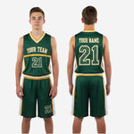 Detail view of green and gold youth basketball uniform shorts showing player number on lower left leg panel and elastic gold-striped waistband