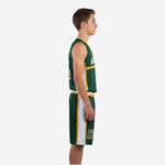 Side view of green and gold youth basketball uniform showing white side panel on jersey and shorts with gold accent stripe detail