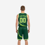 Side view of the forest green reversible basketball jersey showing armhole binding and swoosh graphic running to the hem
