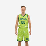 Lime side of the green and white reversible basketball uniforms with white geometric starburst print and forest-green trim on male model