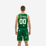 Side view of the green and white reversible basketball uniform showing armhole binding and shorts side split detail