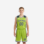 Custom green youth basketball uniforms in lime green and charcoal with team name, front number, and matching shorts - full set front and back view
