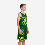 Front view of custom kids basketball uniforms in forest green with neon claw-slash graphic team name arc and white front number on youth boy model