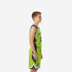 Front view of custom green youth basketball uniforms showing lime green body, charcoal chevron side panels, arced team name, and front number 00