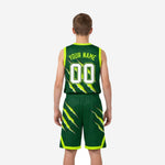 Opposite side view of junior basketball uniforms in forest green displaying diagonal neon slash graphic on jersey and shorts with bound hem detail