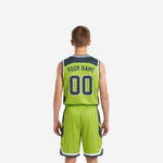Opposite side view of green youth basketball uniform set highlighting charcoal chevron side panel pattern on shorts and jersey