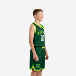 Side view of custom green youth basketball uniform set showing neon-lime sweeping side panel and shorts hem trim detail