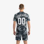 Detail shot of grey black camo custom soccer jersey and shorts showing team name and number print placement