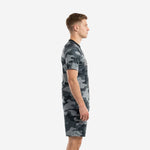Side view of grey and black custom soccer uniform set showing camo jersey and matching shorts on adult male model
