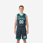 Grey youth basketball uniforms charcoal and teal full set showing jersey front and matching shorts front view on youth boy