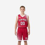 Youth boy wearing custom red youth basketball uniforms with white halftone fade pattern on jersey and matching shorts, front and back view