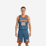 Home and away reversible basketball uniforms in steel blue with orange slash accents and matching shorts, front view of full set