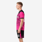 Right side view of custom sublimated hot pink soccer uniform with black yoke and leopard pattern fading toward hem
