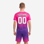 Close detail of hot pink chest area on custom pink soccer jersey showing sublimated team name arch and front player number in white