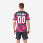 Full soccer uniform set in hot pink and charcoal digital camo, jersey and shorts included