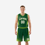 Custom kelly green basketball uniforms two-piece set with lime green side panels worn by adult male player, front view showing arced team name and number