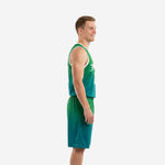 Adult male wearing custom kelly green basketball uniform set, front view showing arced team name, front number, and matching teal fade shorts