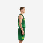 Adult male wearing custom kelly green basketball uniform set with sublimated pinstripe jersey and crew neck binding, full front view
