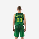 Opposite side view of kelly green and neon yellow-green basketball uniform showing elastic waistband trim and shorts hem detail