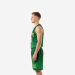 Side view of kelly green sublimated basketball jersey and shorts set showing pinstripe pattern alignment across both pieces