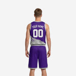 Purple reversible basketball jersey side view showing silver V-neck binding and armhole binding with slash graphic detail