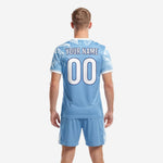 Detail view of light blue and white geometric crystal design on custom soccer jersey and shorts set