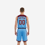 Side view of light blue and maroon reverse side of custom reversible basketball uniform with maroon binding and shoulder accents