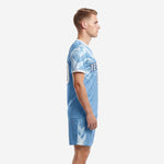 Left side view of light blue custom soccer uniform showing geometric shoulder print and chevron shorts detail