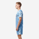 Right side view of light blue soccer uniform kit with white crystal pattern on jersey and sublimated shorts