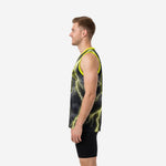 Side view of custom lime green and black sublimated basketball jersey showing athletic sleeveless cut and neon armhole binding on male model