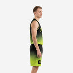 Side view of black to lime green gradient basketball uniform showing V-neck collar, armhole binding, and mid-thigh shorts with drawcord waistband