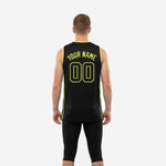 Opposite side view of the black and neon lime green basketball jersey displaying the full-length side stripe and athletic sleeveless cut