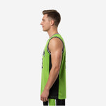 Left side view of lime green and black basketball jersey showing black side panel construction and straight hem with hip side vents