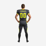 Back view of custom lime green football uniforms showing back number placement and charcoal pant with neon-green side stripe