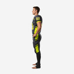 Opposite side view of charcoal and lime-green custom football uniform showing sleeve band detail and full-length pant stripe