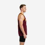 Front view of custom maroon and gold basketball jersey showing gold arched team name and number 00 with white outline on deep maroon body
