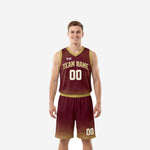 Custom maroon and gold basketball uniforms full set with sunburst ray pattern on jersey and halftone dot fade on matching shorts front view
